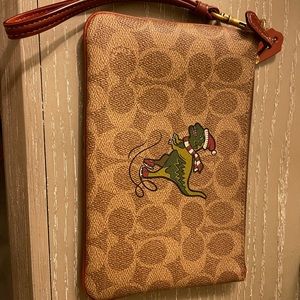 COPY - Coach wristlet with dinosaur logo